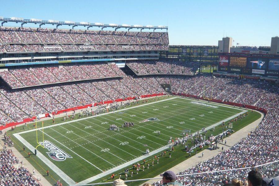 NFL Coach Defends Himself Amidst Controversial Photos with Reporter